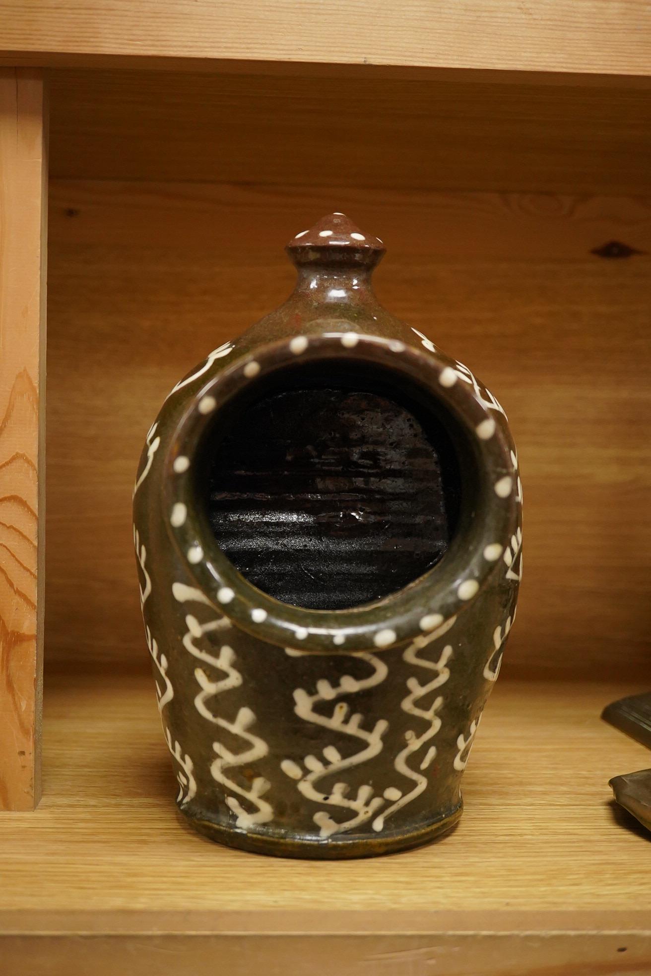 A slipware pottery salt jar, 27cm high